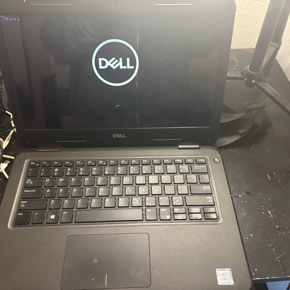 Dell Black Professional Laptop with QWERTY Keyboard and Sleek Design